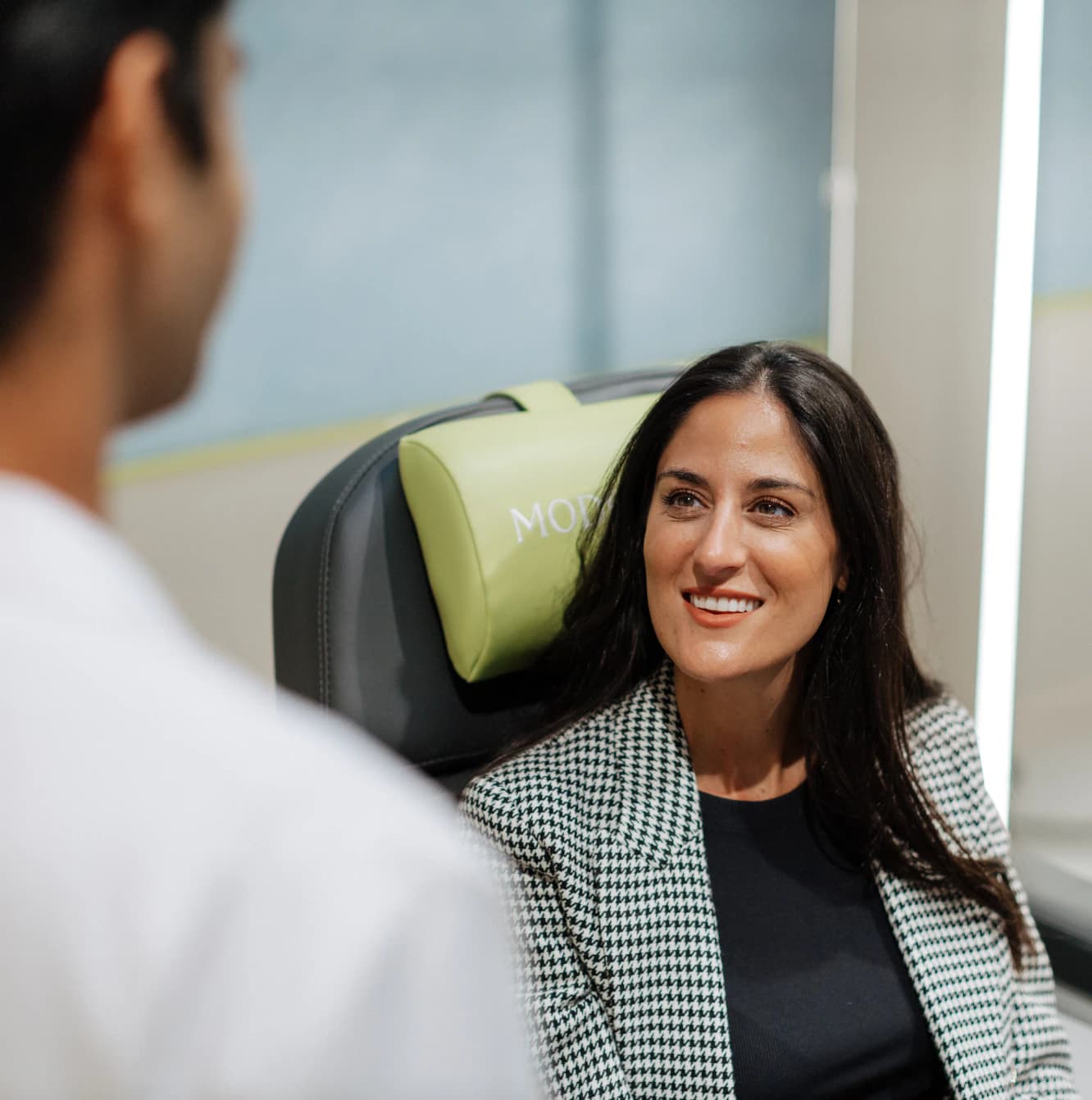 A clinician reviewing results with a smiling client