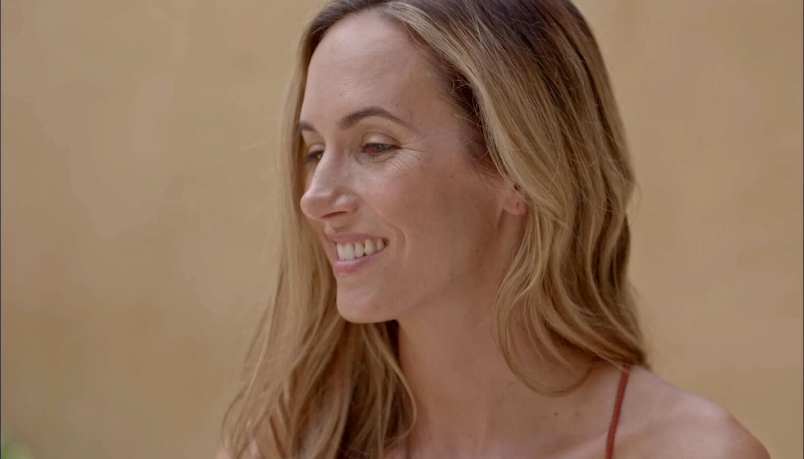 A woman smiling, from the Modern Age homepage film